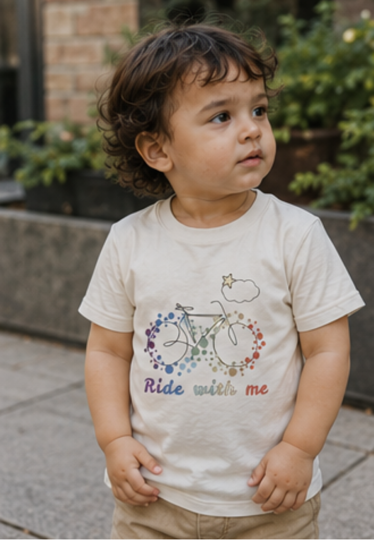 Autistic toddler wearing cream Ride With Me autism awareness T-shirt in a calm urban park, sensory-friendly clothing for neurodivergent children.
A young autistic toddler wearing the Kids in Rainbows Ride With Me sensory-friendly T-shirt in a peaceful outdoor setting. Designed to celebrate neurodiversity, inclusion, autism acceptance, and different ways of experiencing the world. Soft cotton clothing for autistic children, sensory-sensitive kids, and neurodivergent families.