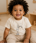Toddler wearing a T-shirt with message to encourage acceptance of different pace of development