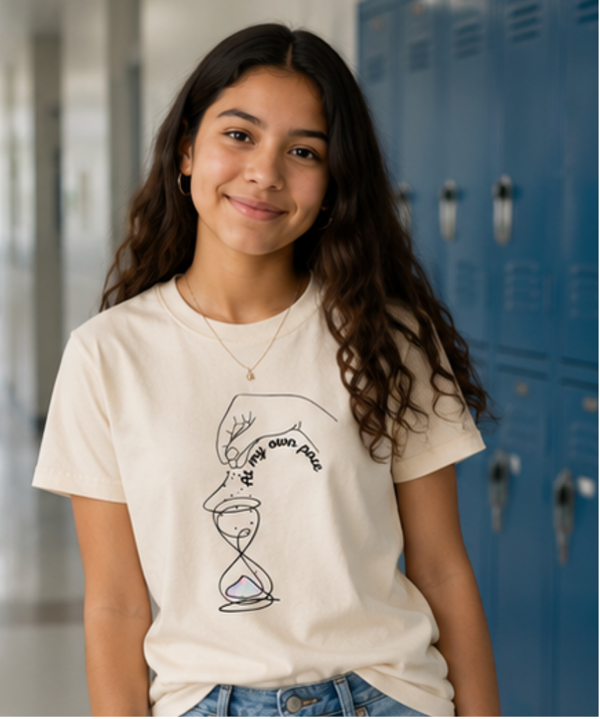 Young girl wearing a T-shirt to support different paces in neurodevelopment. Sensory-friendly